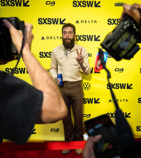 Post Malone poses on the red carpet before the premiere of Road House at the Paramount Theatre in Austin, Texas on the first day of South by Southwest, Friday, March 8, 2024.