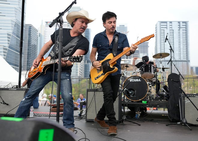 Bruce Castleberry, left, and A.J. Vallejo of the band Vallejo perform at the Steamboat 1874 Reunion Concert at Auditorium Shores during SXSW Thursday March 14, 2024. The concert featured Austin bands that frequently performed at the Sixth Street venue in the 90s.