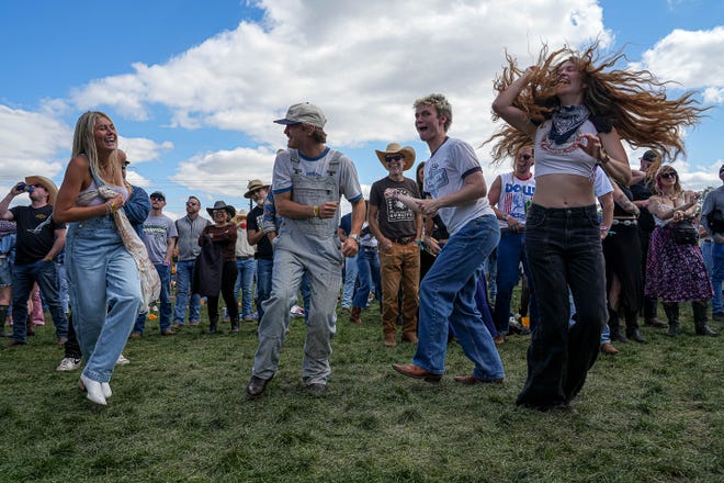 From left, Reese Herbert, Bo Staloch, Ronin Kiekbusch and Maddie Kerr dance during Sierra Ferrel's set on the Big River stage at the Two Step Inn country music festival at San Gabriel Park on Sunday, April 21, 2024 in Georgetown, Texas.